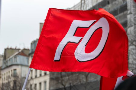Photo for Paris, France - January 19, 2023: Logo of the French trade union organization FO (Force Ouvriere) printed on a red flag shot close-up during a demonstration - Royalty Free Image
