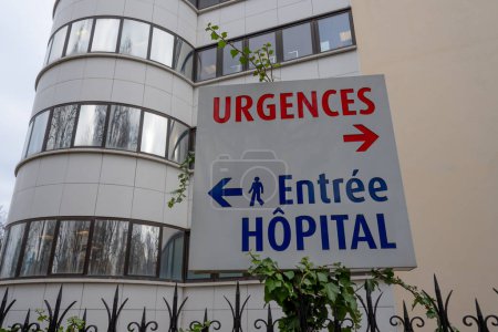 Photo for Sign written in French indicating the directions of the emergency medicine department and the pedestrian entrance of a hospital in France - Royalty Free Image