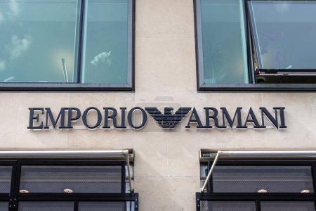 Paris, France - March 29, 2023: Commercial sign and logo of an Emporio Armani store, Italian clothing fashion brand created by designer Giorgio Armani