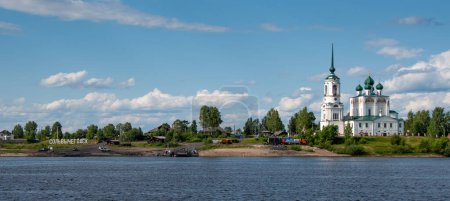 Photo for Panoramic view of Solvychegodsk (with its name written in Russian) and of the Cathedral of the Annunciation, shot from the Vychegda river embankment, Arkhangelsk region (oblast), Federation of Russia - Royalty Free Image
