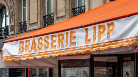 Photo for Paris, France - February 23, 2024: Close-up of the sign on the awning of Brasserie Lipp, a famous traditional Parisian brasserie located in the Saint-Germain-des-Pres district - Royalty Free Image