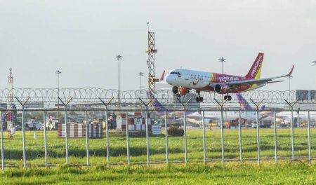 Photo for Samut Prakan, Thailand: August 28, 2023:  Vietjet Air plane is landing on runways Suvarnabhumi International Airport.- editorial - Royalty Free Image