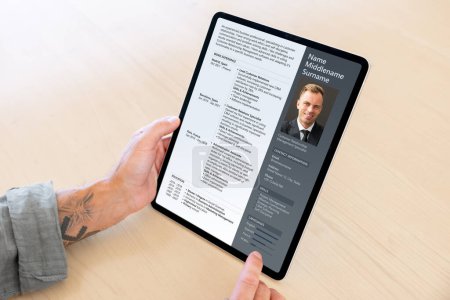 Photo for Sample CV document shown on tablet computer - Royalty Free Image