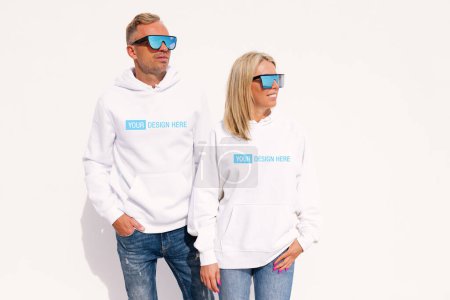 Photo for Woman and man wearing white hoodies, mockup for your custom hoody sweatshirt design - Royalty Free Image