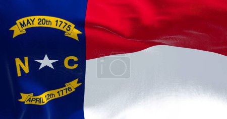 Téléchargez les photos : North Carolina state flag waving. North Carolina is a state in the Southeastern region of the United States. Rippled fabric. Textured background. Selective focus. Realistic 3d illustration - en image libre de droit