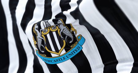 Téléchargez les photos : Newcastle, UK, May 2022: Fabric background with the Newcastle United flag waving. Rippled fabric. Textured background. Realistic 3d illustration. selective focus. close-up. - en image libre de droit