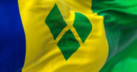 Foto de Saint Vincent and the Grenadines national flag waving. Saint Vincent is a state in the Lesser Antilles of Central America. Rippled fabric. Textured background. 3d illustration. Close-up - Imagen libre de derechos