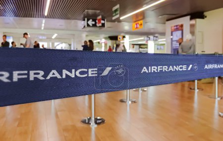 Photo for Paris, FR, Jan 2023: Blue belt barrier with white Air France and Sky Team logo. Air France is the french flag carrier. Travel and airport security - Royalty Free Image