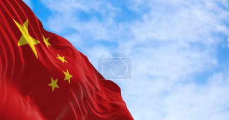 The flag of China waving on a sunny day. Red background, five yellow stars. The largest star symbolizes the guidance of the Chinese Communist Party. 3D illustration render. Rippled fabric