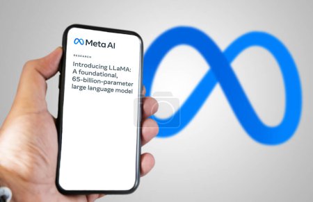 Photo for Menlo Park, US, Feb 2023: hand holding a phone with Meta AI LLaMa news on the screen. Meta LLaMA is a new language model based on artificial intelligence developed by Meta. Illustrative editorial - Royalty Free Image
