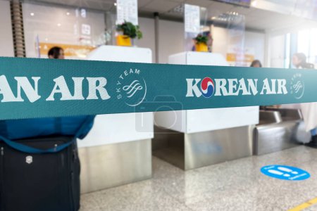 Photo for Seoul, KR, Jan 2023: Cyan barrier tape with the Korean Air logo inside an airport. Korean Air is the flag carrier of South Korea. Travel and airport security. Illustrative editorial - Royalty Free Image