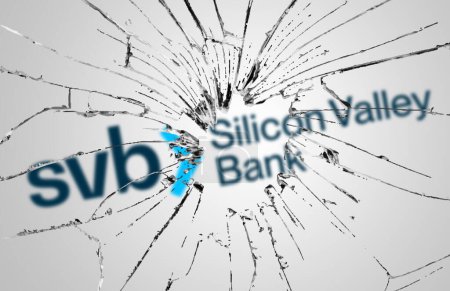 Photo for Santa Clara, USA, March 2023: Broken glass with the Silicon Valley Bank logo blurred in the background. Bank run and bankruptcy. Finance and economy. Illustrative editorial - Royalty Free Image