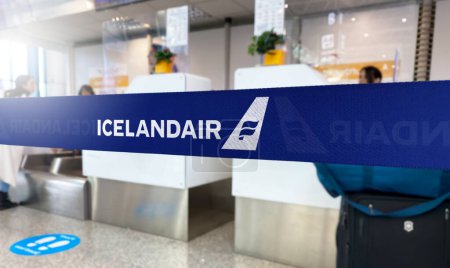 Photo for Reykjavik, IS Jan 2023: Blue barrier tape with the Icelandair logo inside an airport. Icelandair is the flag carrier airline of Iceland. Travel and airport security. Illustrative editorial - Royalty Free Image