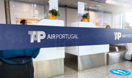 Photo for Lisbon, PT Jan 2023: Blue retractable belt barrier with white TAP Air Portugal logo. TAP Air Portugal is the portuguese flag carrier airline. Travel and airport security. Illustrative editorial - Royalty Free Image