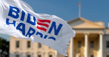 Photo for Washington D.C., US, april 2023: Flag with Biden Harris 2024 presidential election campaign logo waving in front a blurred White House. Illustrative editorial 3d illustration render - Royalty Free Image