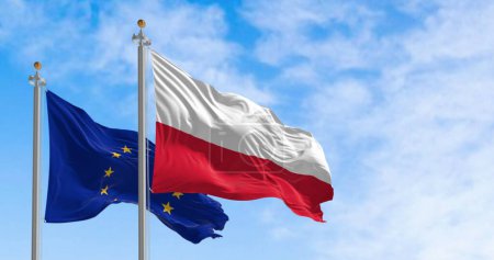 Téléchargez les photos : Les drapeaux de la Pologne et de l'Union européenne agitant le vent par temps clair. La Pologne est devenue membre de l'UE en mai 2004. Illustration 3D rendu. Tissu flottant - en image libre de droit