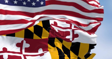 Foto de Primer plano de la bandera del estado de Maryland ondeando en el viento con una parte borrosa de la bandera nacional de los Estados Unidos en el fondo. Imagen patriótica y simbólica. 3d render ilustración. Enfoque selectivo - Imagen libre de derechos