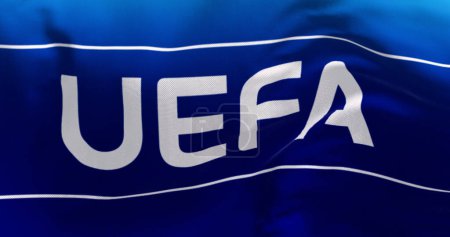 Foto de Nyon, CH, abril de 2023: Primer plano de la bandera de la UEFA ondeando en el viento. La UEFA es la asociación que gestiona el fútbol profesional en Europa. Ilustración editorial ilustrativa 3d render - Imagen libre de derechos