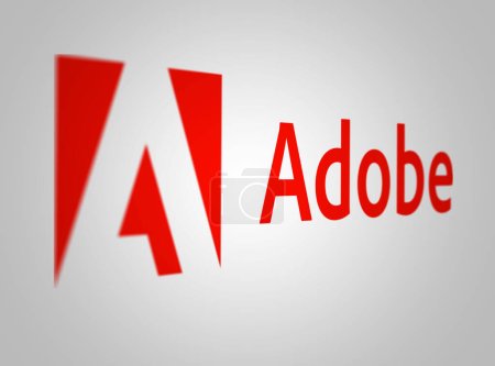 Foto de Nueva York, Estados Unidos, mayo de 2023: Logo de Adobe sobre fondo blanco. Adobe es una corporación multinacional de software especializada en soluciones creativas y digitales. Editorial ilustrativo. Enfoque selectivo - Imagen libre de derechos