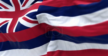 Nahaufnahme der Flagge des Bundesstaates Hawaii, die im Wind weht. Acht horizontale Streifen weiß, rot, blau, Union Jack im Kanton. 3D Illustration rendern. Flatternder Stoff. Selektiver Fokus