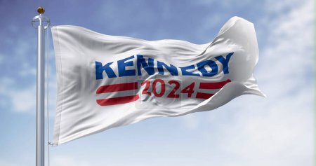 Foto de San Diego., EE.UU., 2 de abril de 2023: Kennedy 2024 bandera de campaña presidencial ondeando en un día claro. Primarias del partido demócrata. Ilustración editorial ilustrativa 3d render - Imagen libre de derechos