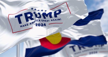 Photo for Denver, US, Dec.20 2023: Trump 2024 campaign flag waving with Colorado State flag. On Dec. 2023 Colorado Supreme Court Rules Trump Ineligible for Presidency. Illustrative editorial illustration - Royalty Free Image
