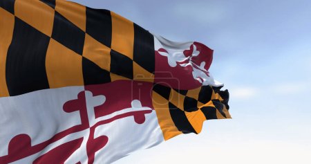 Foto de Bandera del estado de Maryland ondeando en un día despejado. Cuatro cuadrantes con los colores de las familias Calvert y Crossland. 3d render ilustración. Tejido ondulado. Enfoque selectivo - Imagen libre de derechos