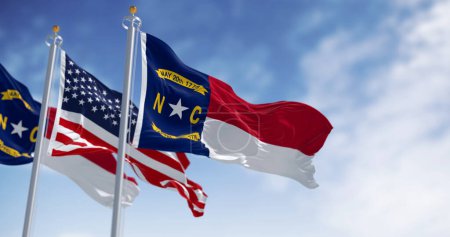North Carolina state flags waving with american flag. North Carolina is a state in the Southeastern region of the S. Rippled fabric. 3d illustration render. Selective focus. Rippling fabric