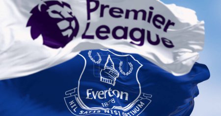 Photo for Liverpool, UK, Sept. 21 2023: Everton Football Club flag waving with Premier League flag. Professional english football club. Illustrative editorial 3d illustration render. Selective focus - Royalty Free Image