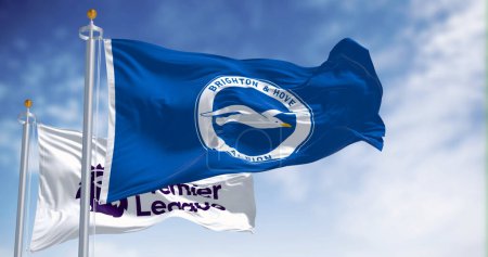 Photo for Brighton, UK, Dec. 23 2023: Brighton football club and Premier League flags waving in the wind on a clear day. Illustrative editorial 3d illustration render. Rippled fabric - Royalty Free Image
