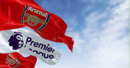Photo for London, UK, July 18 2023: Arsenal Football Club and Premier League flags waving on a clear day. illustrative editorial 3d illustration render. Rippled Fabric. Selective focus - Royalty Free Image