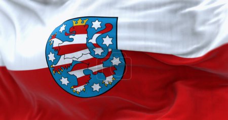 Großaufnahme einer Thüringen-Fahne, die im Wind weht. Thüringen ist ein deutsches Bundesland in der Mitte Deutschlands. 3D Illustration rendern. Selektiver Fokus