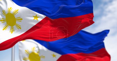 Close-up of Philippines national flag waving. Two equal horizontal blue and red bands, white triangle on the left, golden-yellow sun with eight beams at its center. 3d illustration render