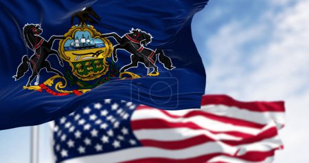 Pennsylvania state flag waving with the american flag. Blue field with state coat of arms: shield between horses, eagle on top. 3d illustration render. Fluttering textile
