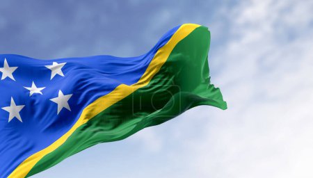National flag of Solomon Islands waving in the wind on a clear day. Solomon Islands is a sovereign country in Oceania. 3d illustration render.