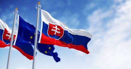Großaufnahme der Slowakei und der Flaggen der Europäischen Union, die an einem klaren Tag im Wind wehen. 3D Illustration rendern. Flatternder Stoff. Selektiver Fokus