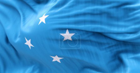 Die Nationalflagge der Föderierten Staaten Mikronesiens weht an einem klaren Tag im Wind. Unabhängiger Staat im Pazifik. 3D Illustration rendern. Selektiver Fokus