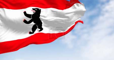 Berlin civil flag waving in the wind on a clear day. Three stripes of red-white-red with a bear on the center. 3d illustration render. Fluttering fabric. Close-up