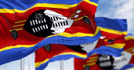 Close-up of swatini national flag waving. Stripes of blue, yellow, red, yellow, blue with Swazi shield, feathered stick, spears in center. 3d illustration render. Fluttering fabric. Selective focus