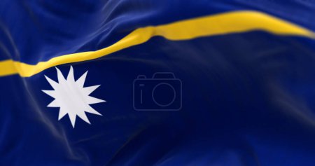 Close-up of Nauru national flag waving in the wind. Island country in Micronesia in the Central Pacific. 3d illustration render. Rippling fabric. Selective focus