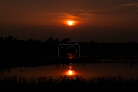 Photo for Sunset is the best moment of the day, in the evening sun goes down, creating different shadows and colors with clouds in the sky. Beautiful sunset God gives, and how it reflects off of the ocean water. - Royalty Free Image