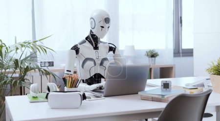 Photo for A robot resembling a human sits at a desk in an office, using a laptop to showcase the value of automation in repetitive and menial tasks. - Royalty Free Image