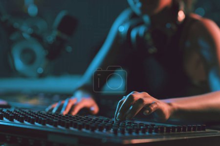 Photo for Sound engineer working in the studio, she is setting up the mixer and recording tracks, hands close up - Royalty Free Image