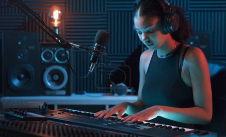 Photo for Young musician working in the recording studio, entertainment and creativity concept - Royalty Free Image
