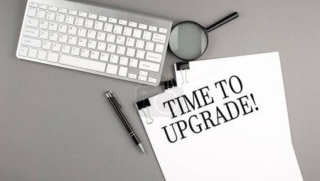 Photo for TIME TO UPGRADE text on a paper with keyboard, magnifier and pen. Business concept - Royalty Free Image