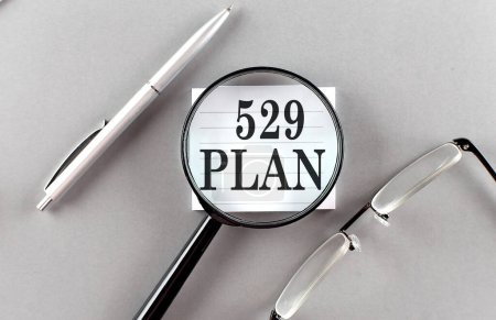 Photo for 529 PLAN text written on a sticky with pencil and glasses text written on sticky with pencil and glasses - Royalty Free Image