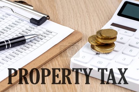 Photo for PROPERTY TAX text with chart and calculator and coins , business - Royalty Free Image
