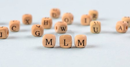 Téléchargez les photos : MLM written on wooden cube , business concept - en image libre de droit
