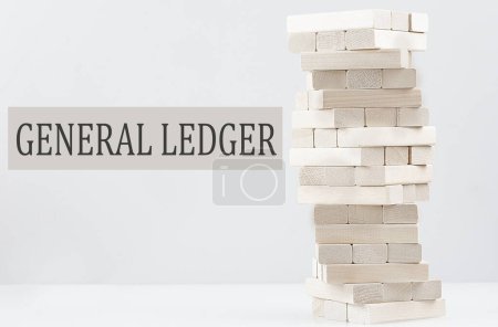 GENERAL LEDGER text with wooden block stack on white background , business