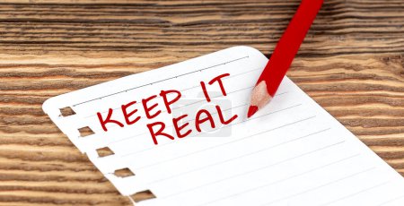 Photo for Word KEEP IT REAL on paper with ped pencil on wooden background - Royalty Free Image